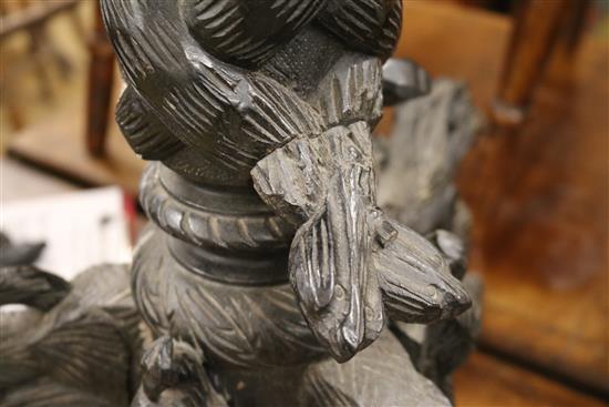 A carved tripod table W.55cm